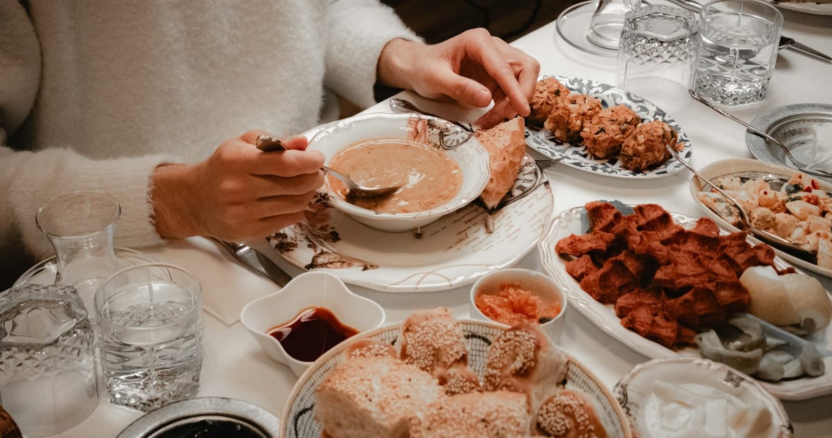 woman eating soup at the table